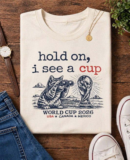 "Hold On I See A Cup" World Cup 2026 Cat Binoculars (Unisex T-Shirt)🐱🔭🏆