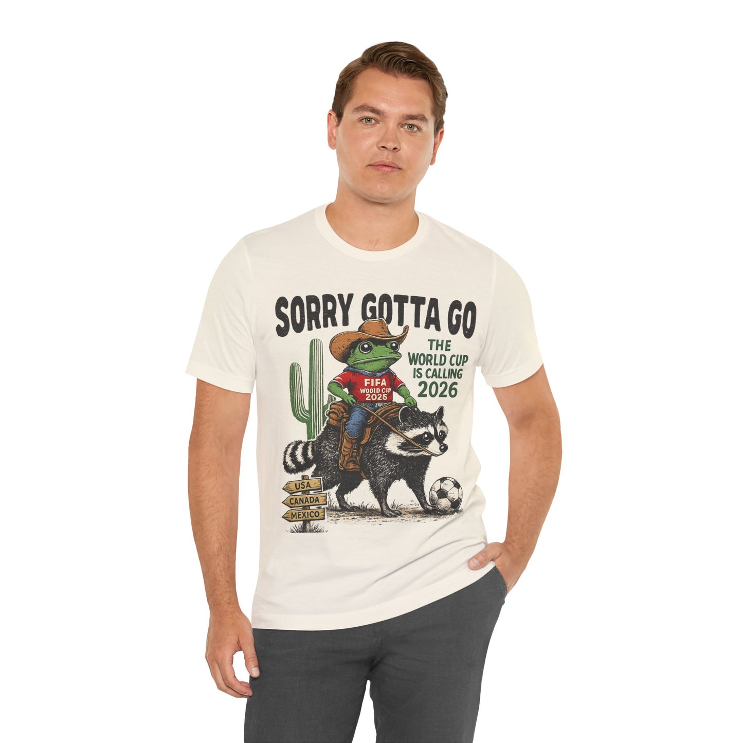 Sorry Gotta Go The World Cup Is Calling 2026" Frog Riding Raccoon( Unisex T-Shirt)🐸🦝⚽🤠